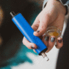 Dip Devices little dipper dab straw vaporizer in ocean blue shown in hand
